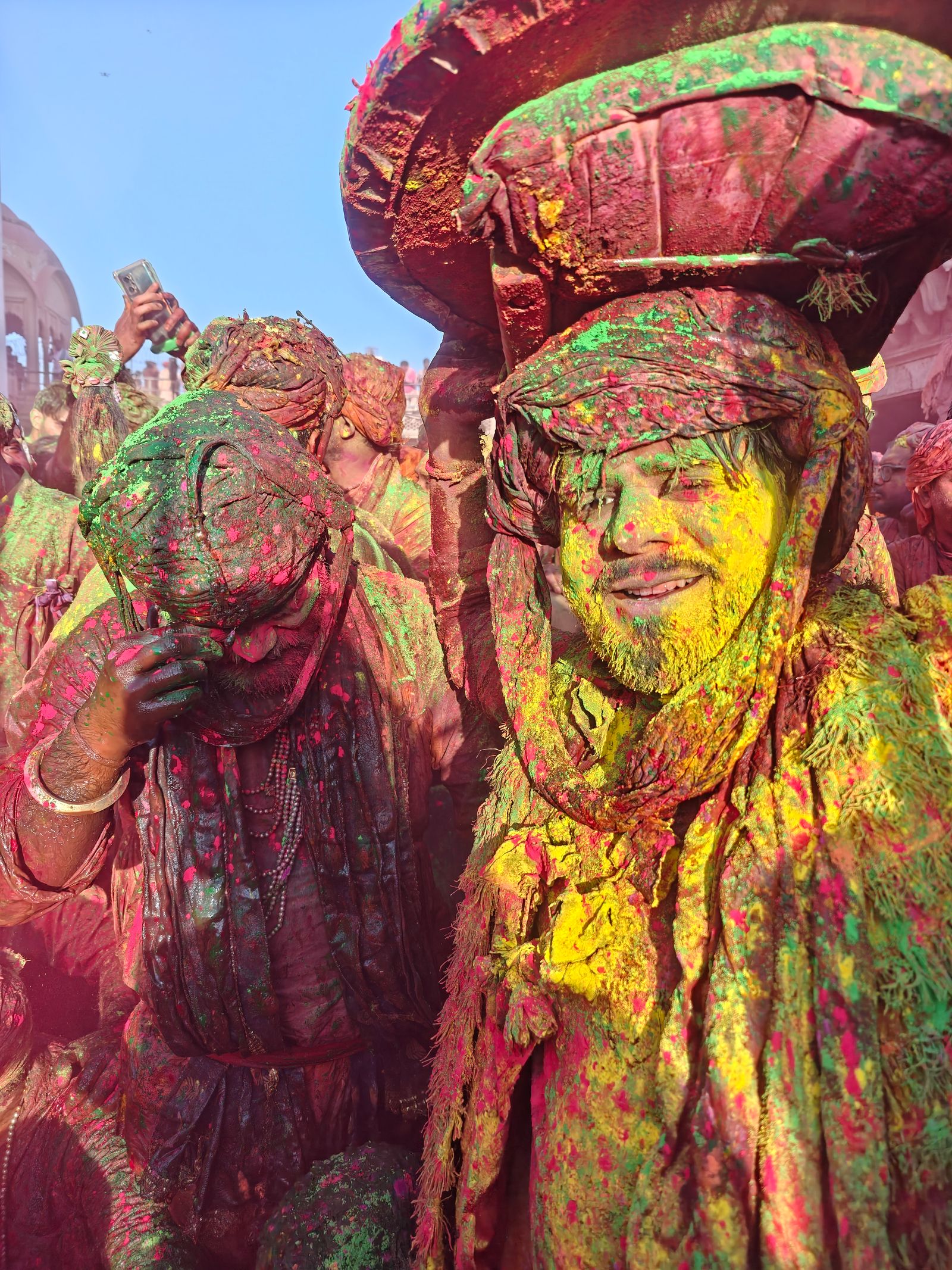 AI face recognition matching a powder-covered face at a Holi festival