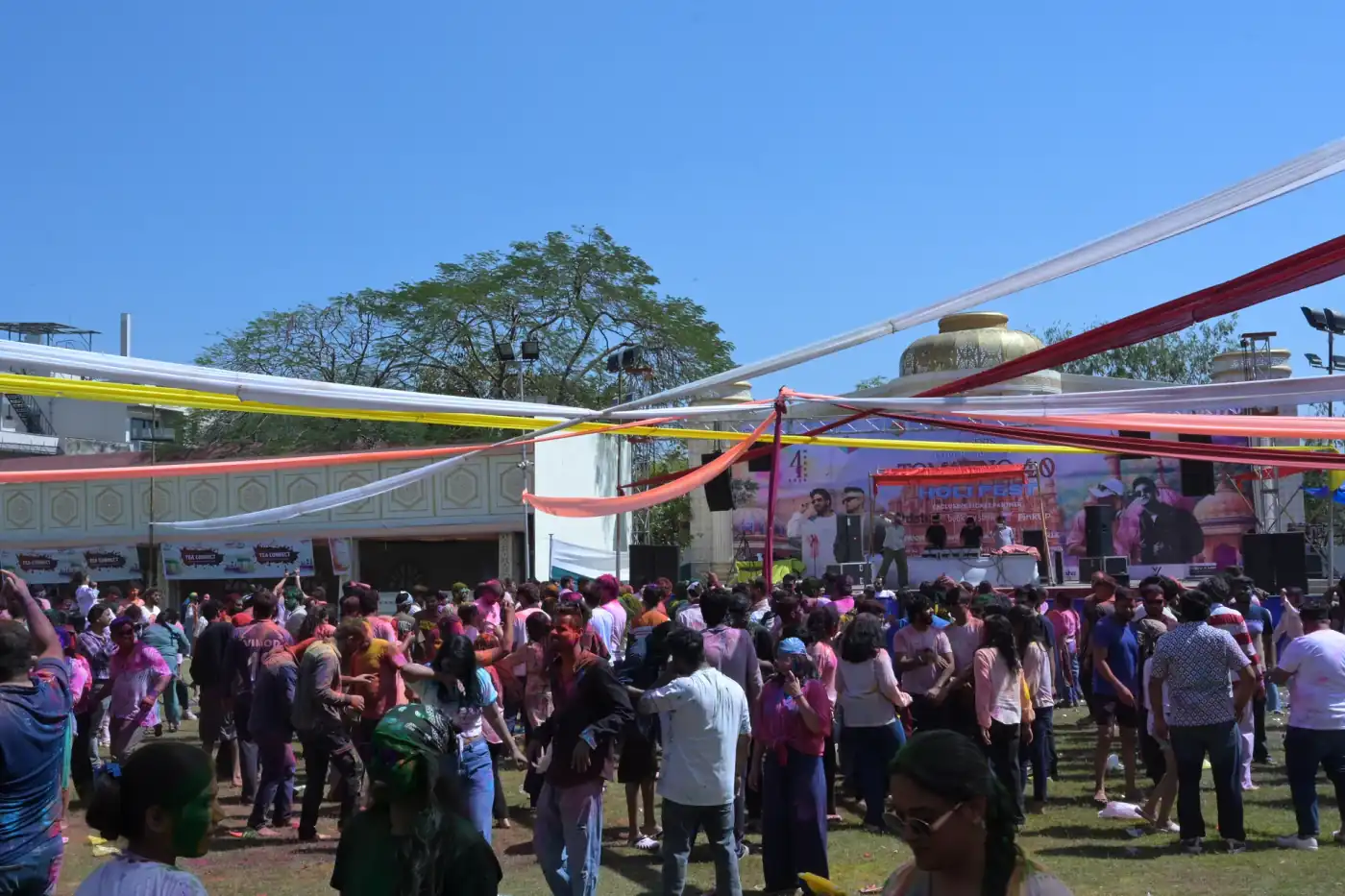 Holi Festival Jaipur — Crowd celebrating at Tomorrow Land Holi Fest with DJ stage